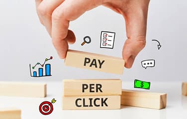 Pay Per Click advertising concept with stacked wooden blocks and marketing icons